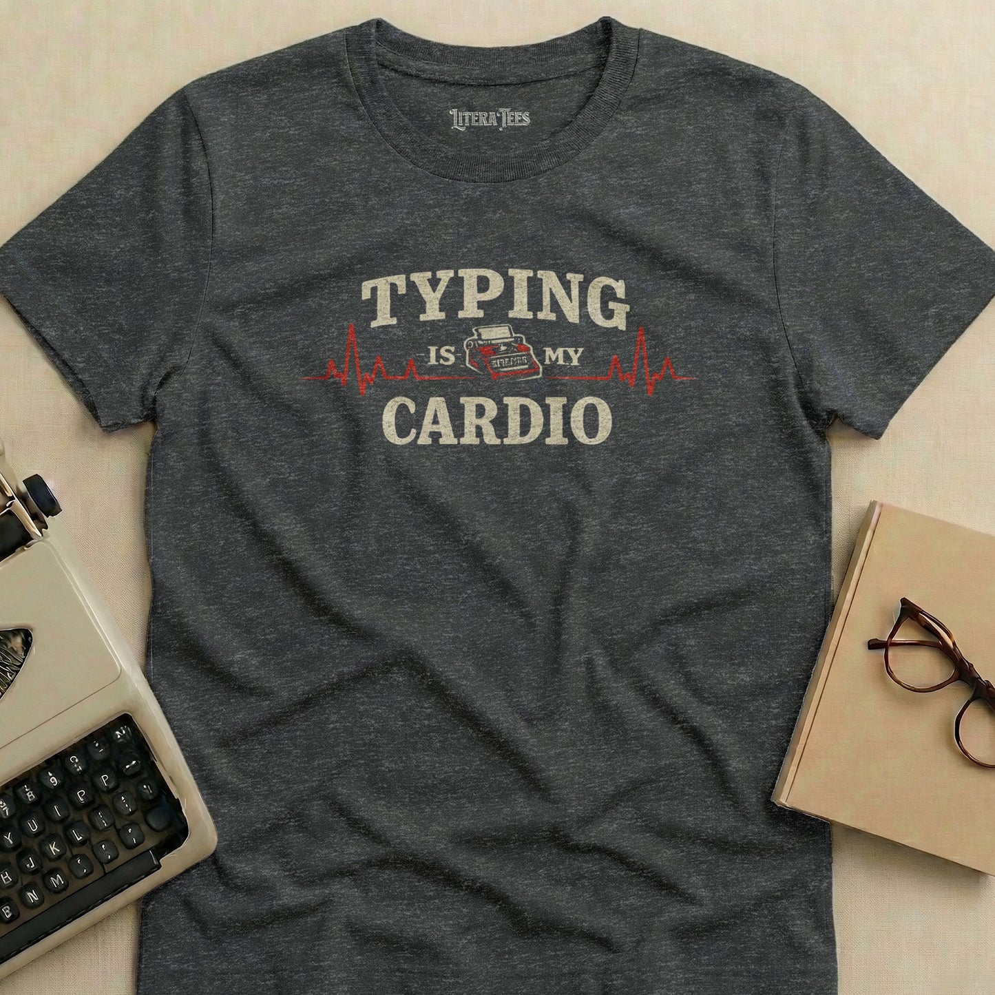 Dark grey t-shirt with "Typing is my cardio" text and a heartbeat line.