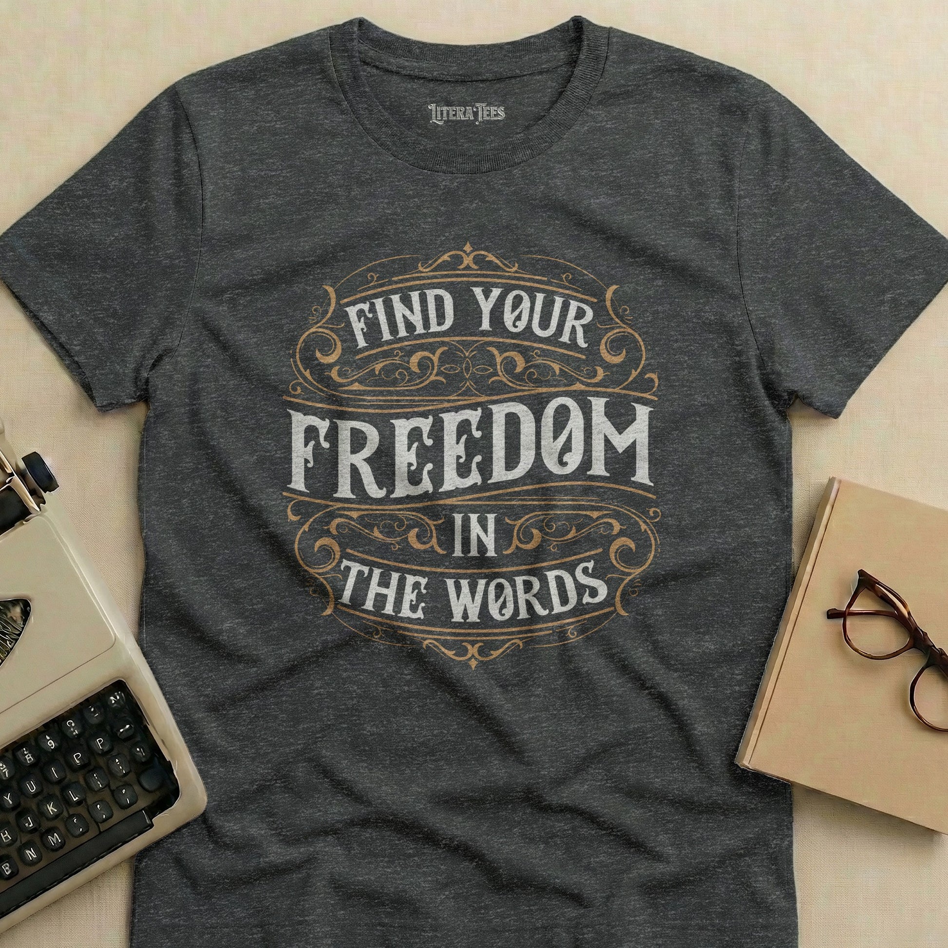 Dark grey t-shirt with "FIND YOUR FREEDOM IN THE WORDS" in distressed lettering.