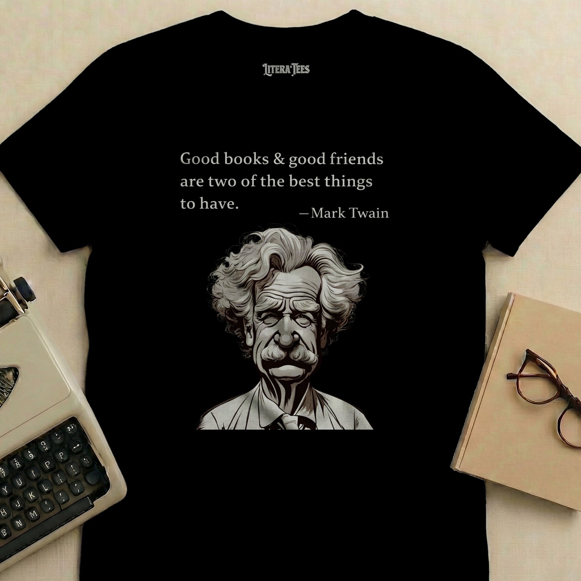 Black t-shirt with Mark Twain quote and illustration, "Good books & good friends".