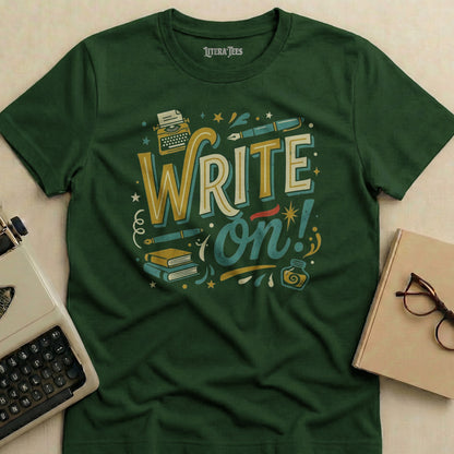 Green t-shirt with "WRITE on!" graphic featuring typewriter, books, and inkwell.