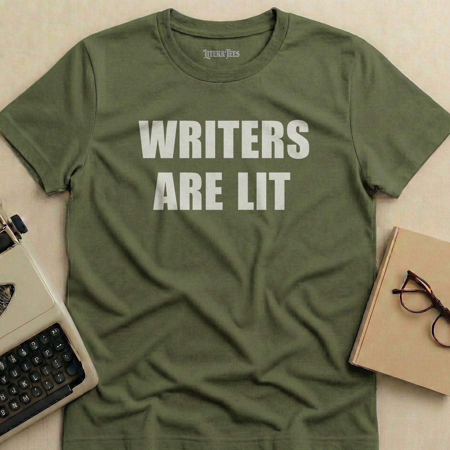 Olive green t-shirt with "WRITERS ARE LIT" in white text.