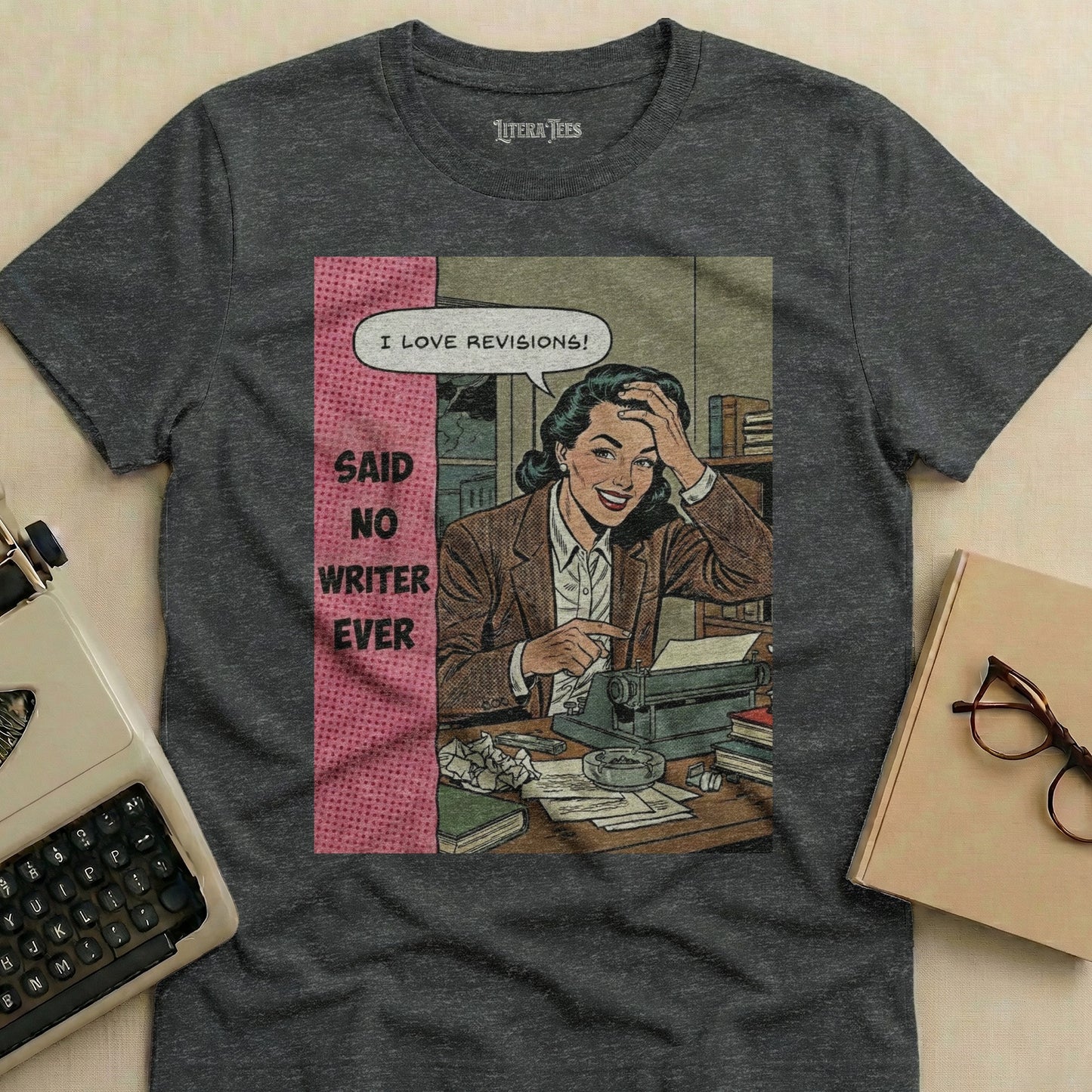 T-shirt with comic art of a woman at a typewriter saying "I love revisions!"