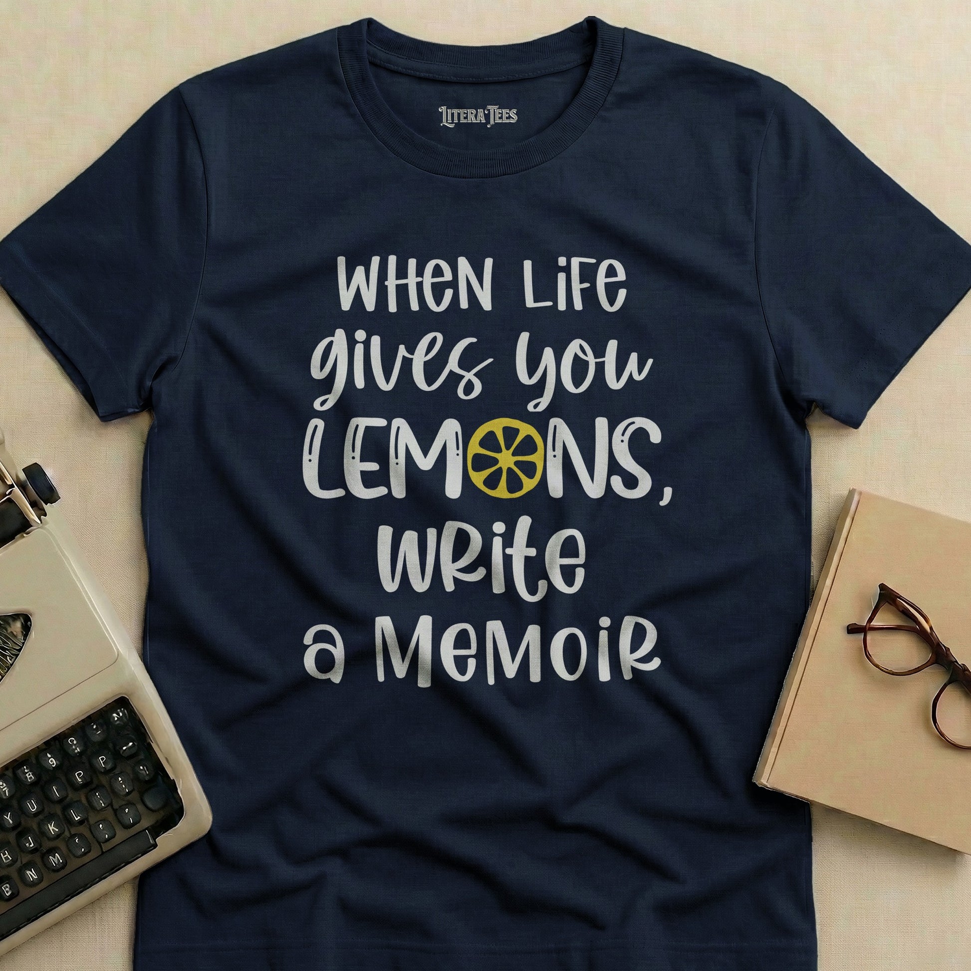 Navy t-shirt with "WHEN LIFE gives you LEMONS, Write a Memoir" text.