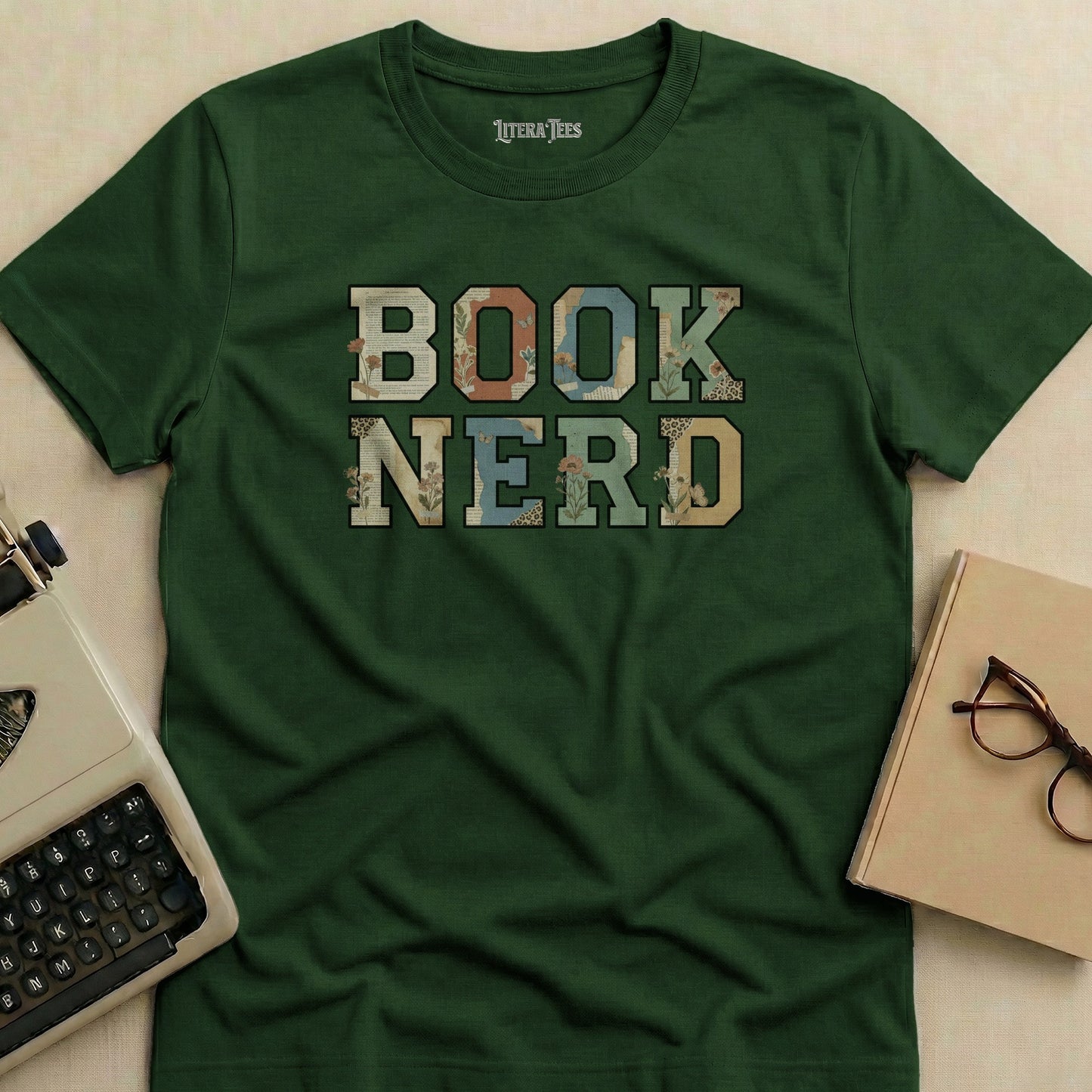 Green t-shirt with "BOOK NERD" text in floral letter blocks.