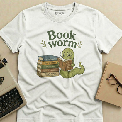 White t-shirt with "Book worm" text and illustration of a worm reading a book.