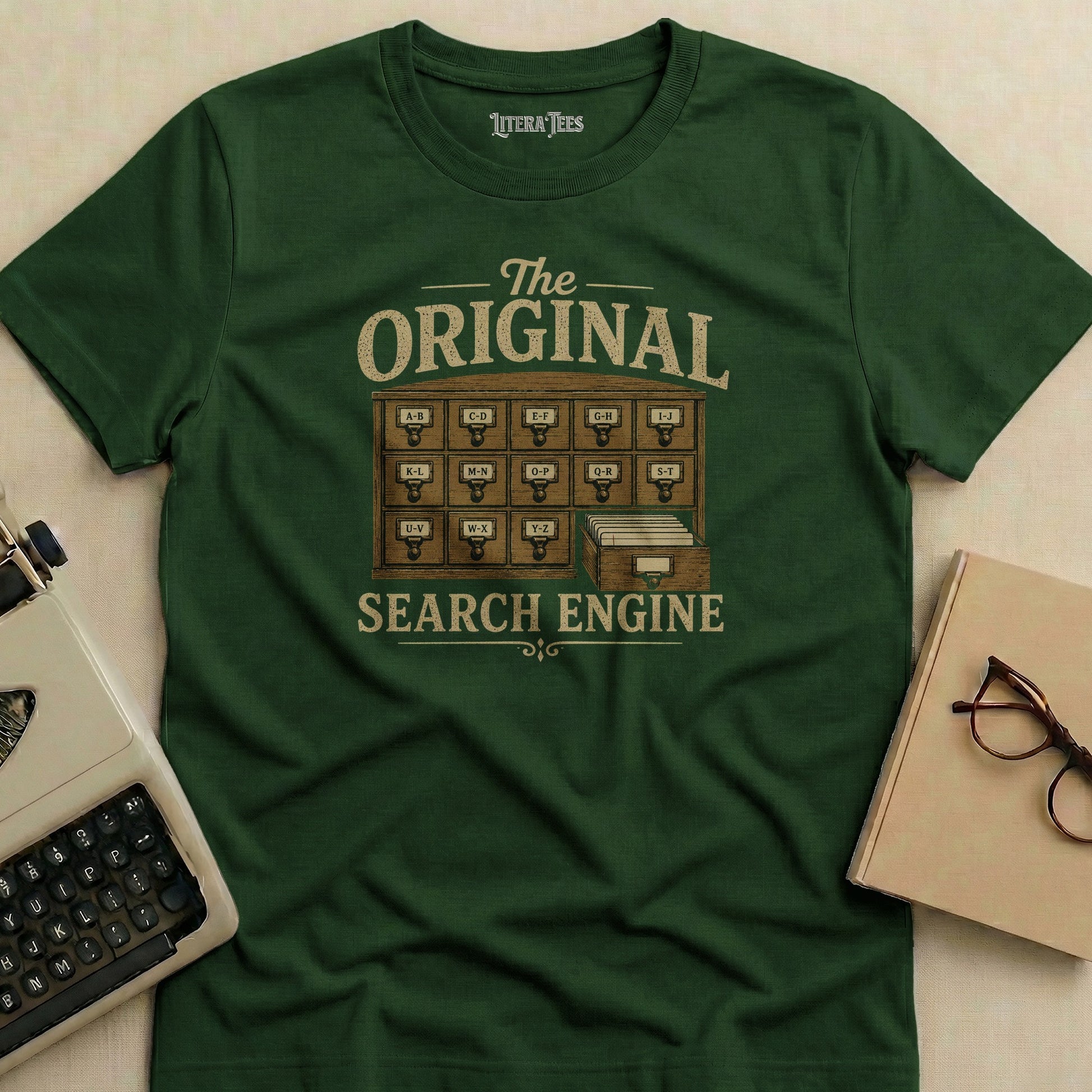 Green t-shirt with "The Original Search Engine" text and card catalog design.