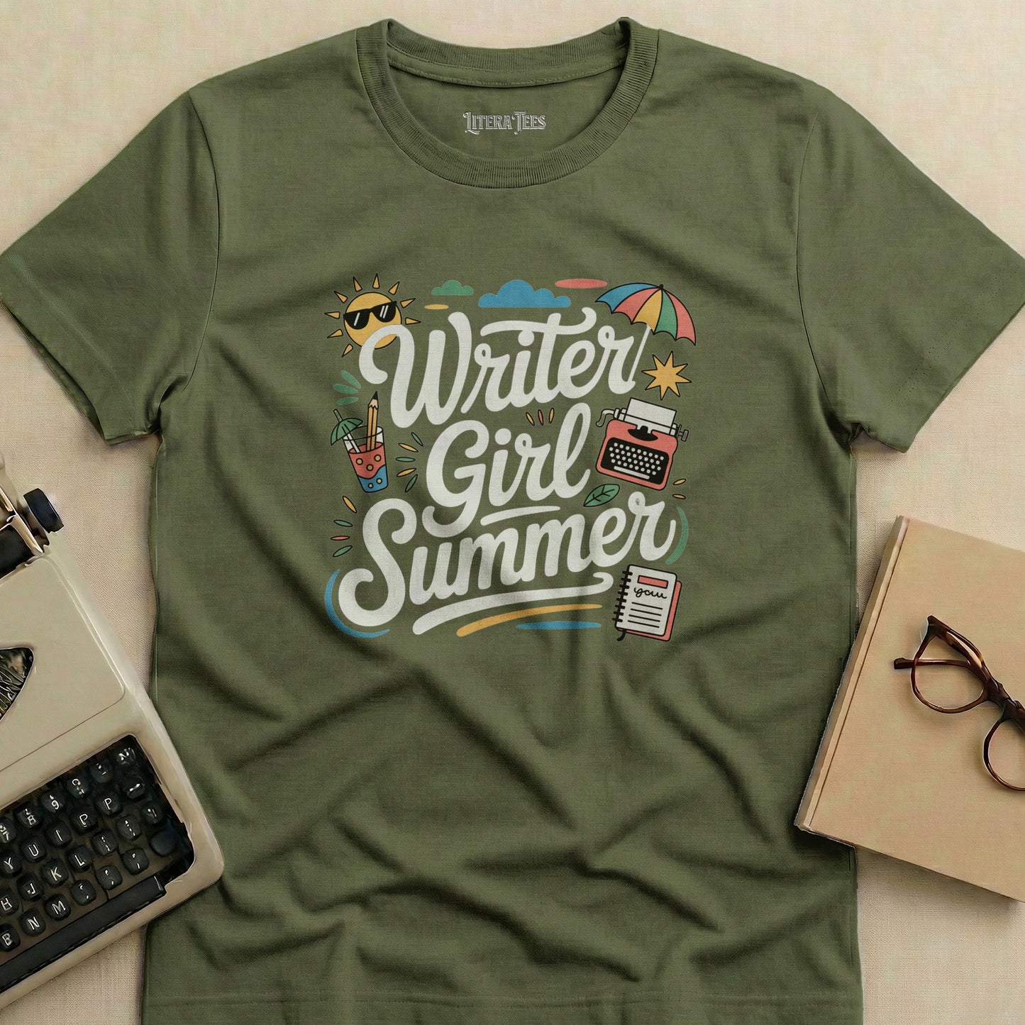 Green t-shirt with "Writer Girl Summer" graphic and vintage typewriter.