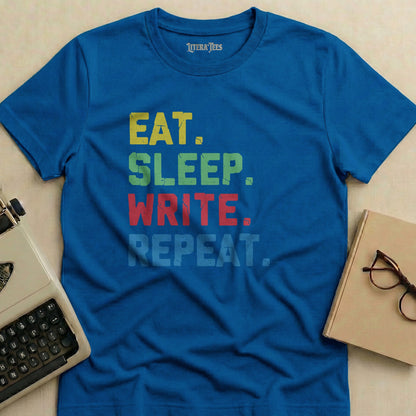 Blue t-shirt with "EAT. SLEEP. WRITE. REPEAT." text in colorful block letters.
