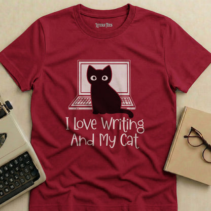 Burgundy t-shirt with "I Love Writing And My Cat" and a cat at a laptop.