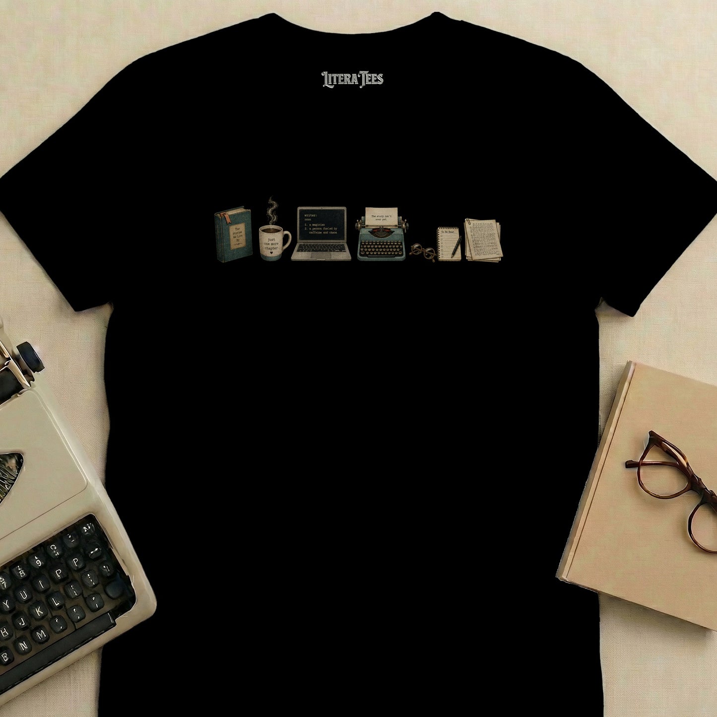 Black t-shirt with literary icons: book, coffee, laptop, typewriter, and glasses.