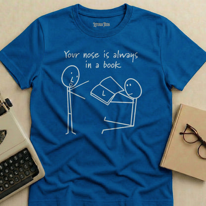 Blue t-shirt with stick figures reading and the text "Your nose is always in a book."