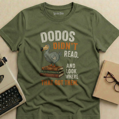 Green t-shirt with "Dodos Didn't Read. And Look Where That Got Them." text and dodo bird graphic.
