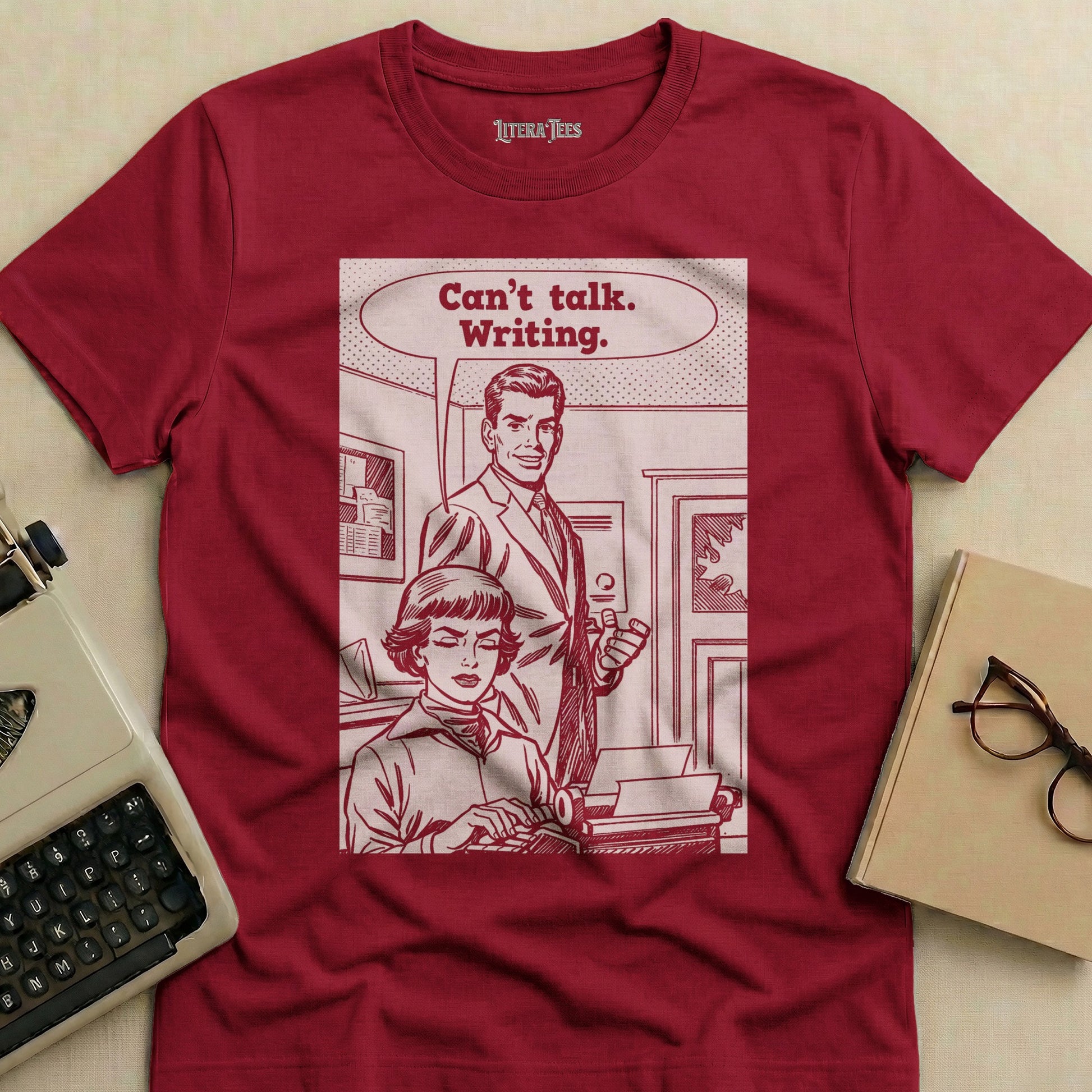 T-shirt with vintage comic illustration of a woman typing and a man speaking.