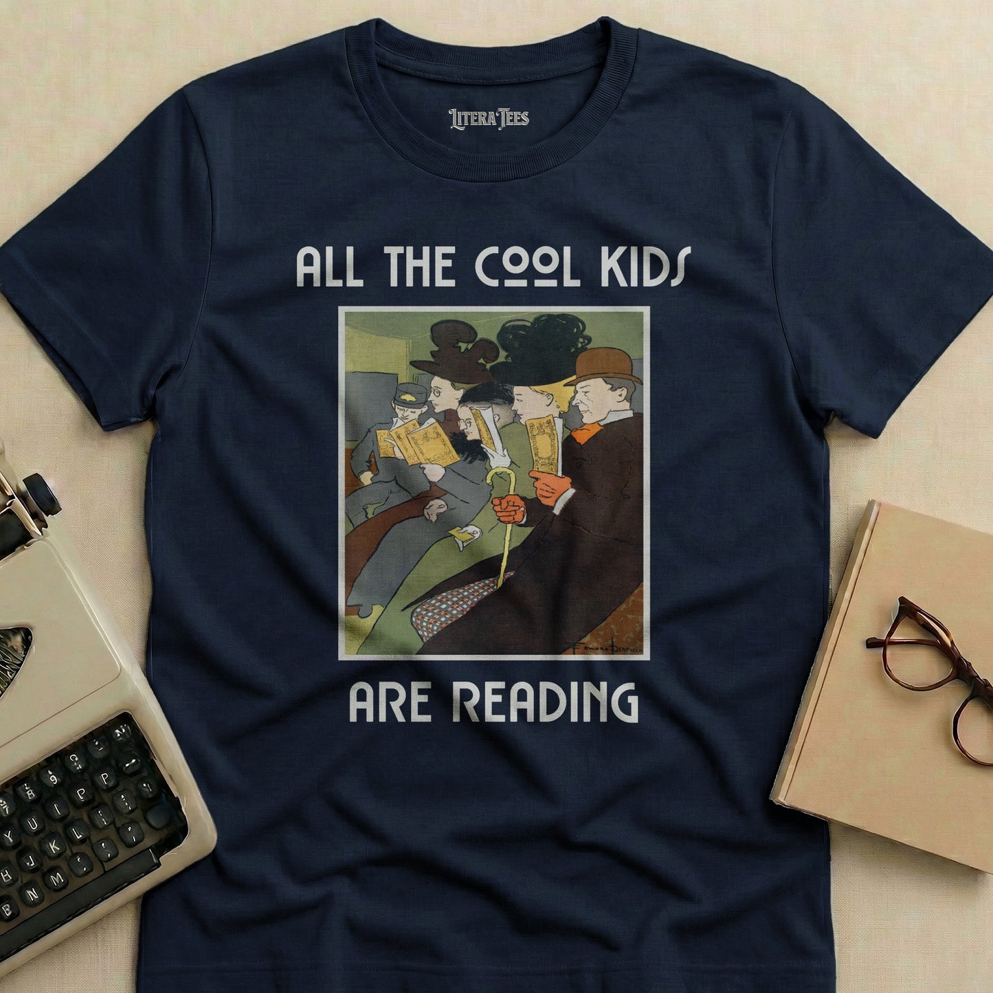 Navy t-shirt with "ALL THE COOL KIDS ARE READING" text and illustration.