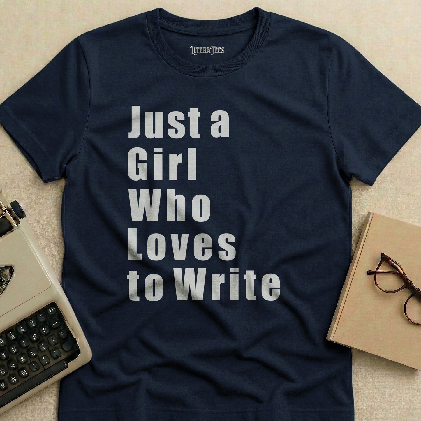 Navy t-shirt with "Just a Girl Who Loves to Write" text.