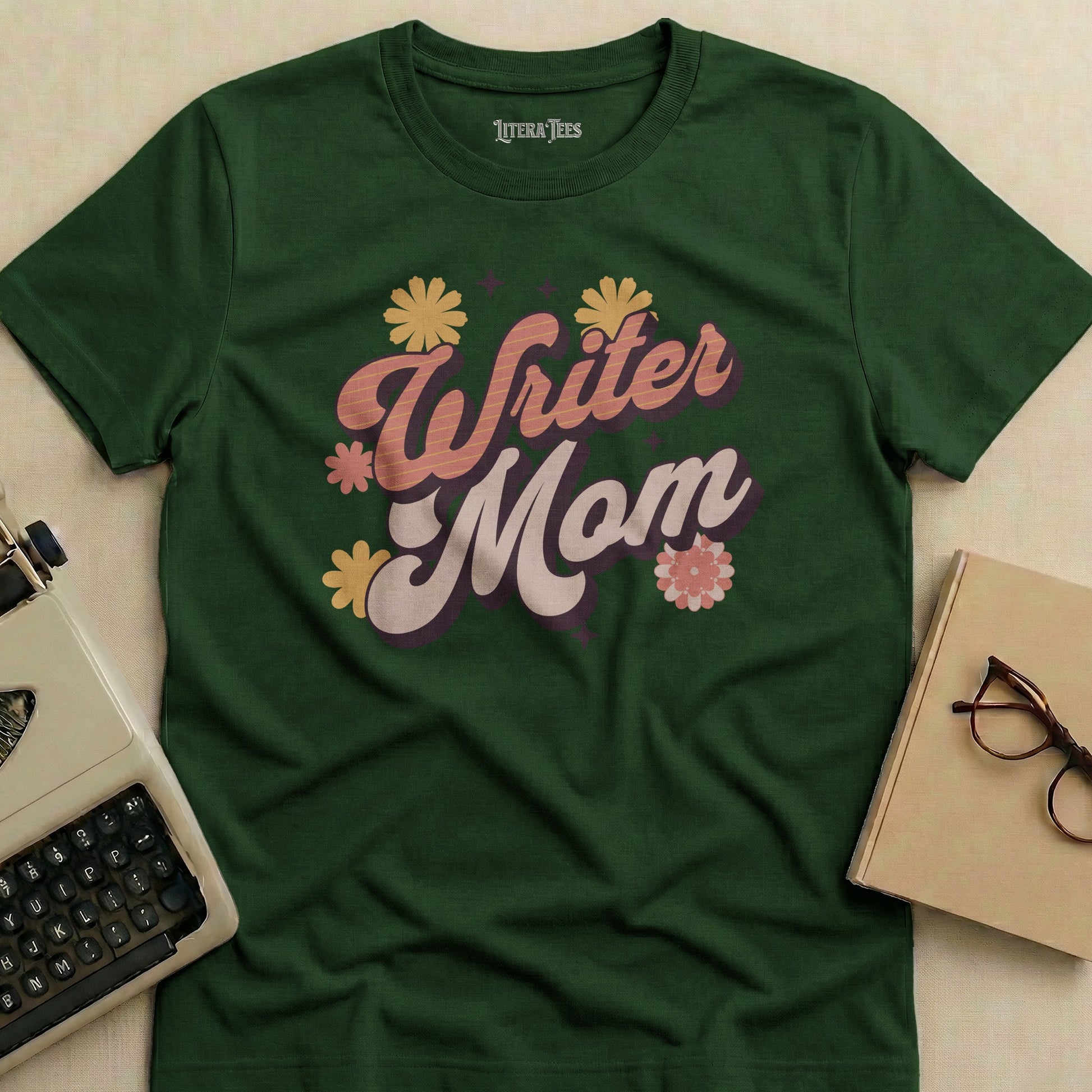 Green t-shirt with "Writer Mom" text and floral accents.