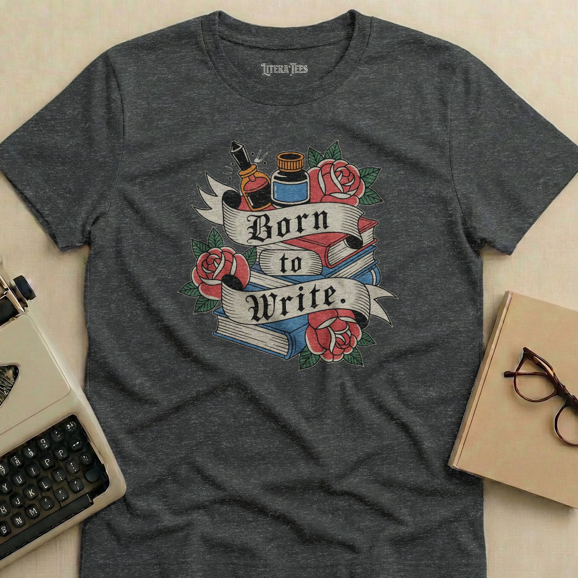 Dark grey t-shirt with "Born to Write" and book illustration.