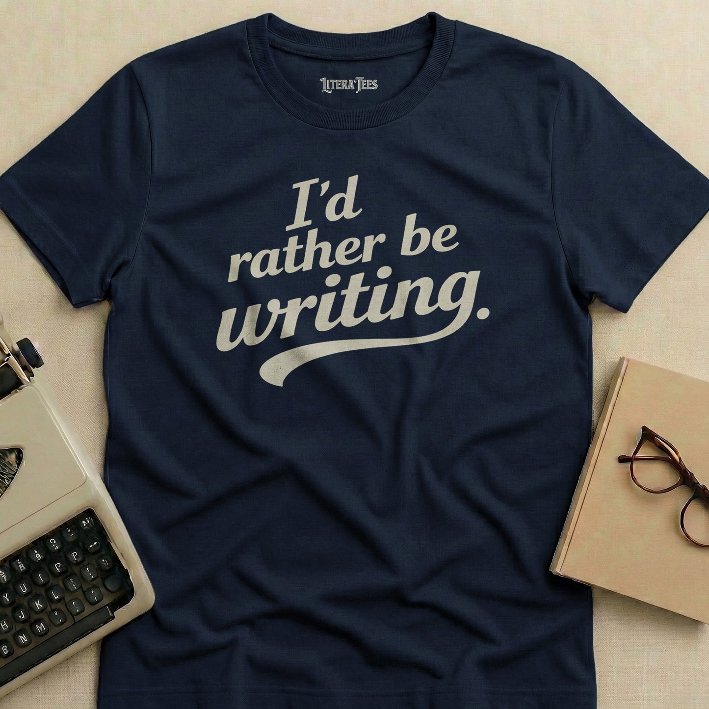Navy t-shirt with "I'd rather be writing." text.