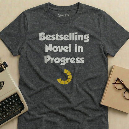 Dark grey t-shirt with "Bestselling Novel in Progress" and a loading bar.