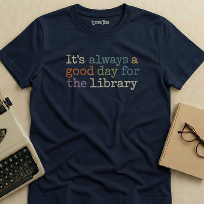 Navy t-shirt with "It's always a good day for the library" text in colorful block letters.