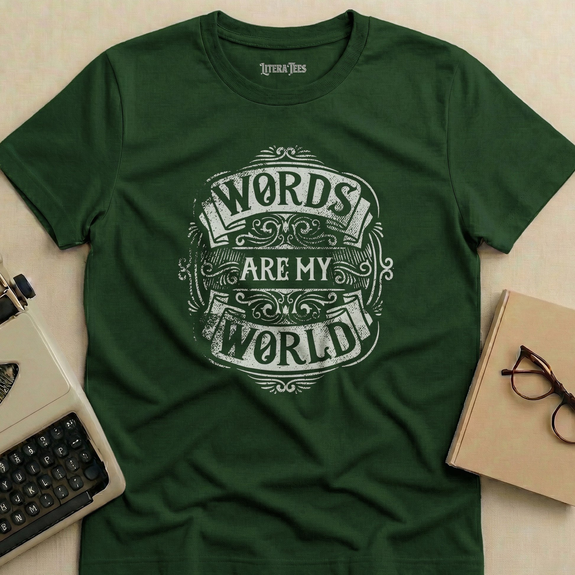 Green t-shirt with white text "Words Are My World" in a decorative emblem.