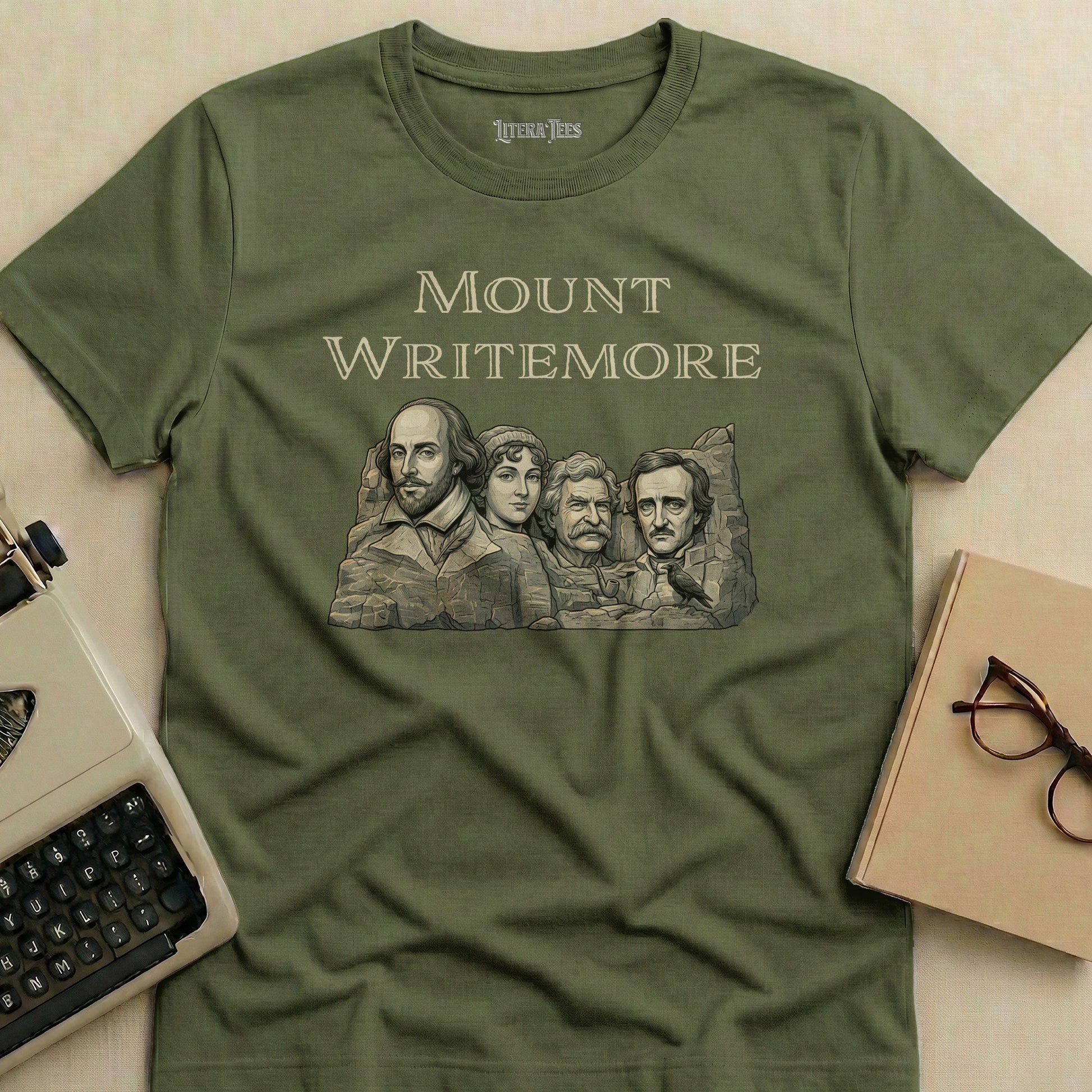 Olive t-shirt with Mount Whittemore literary figures: Shakespeare, Poe, Twain, and Dickinson.