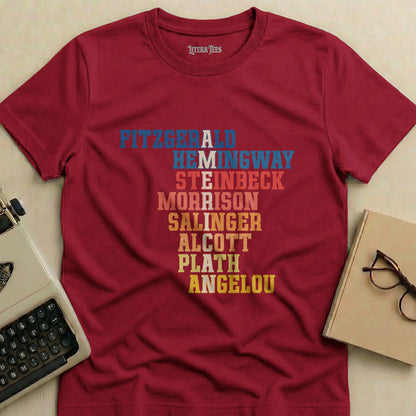 Maroon t-shirt with author names: Fitzgerald, Hemingway, Steinbeck, Morrison, Salinger, Alcott, Plath, Angelou.