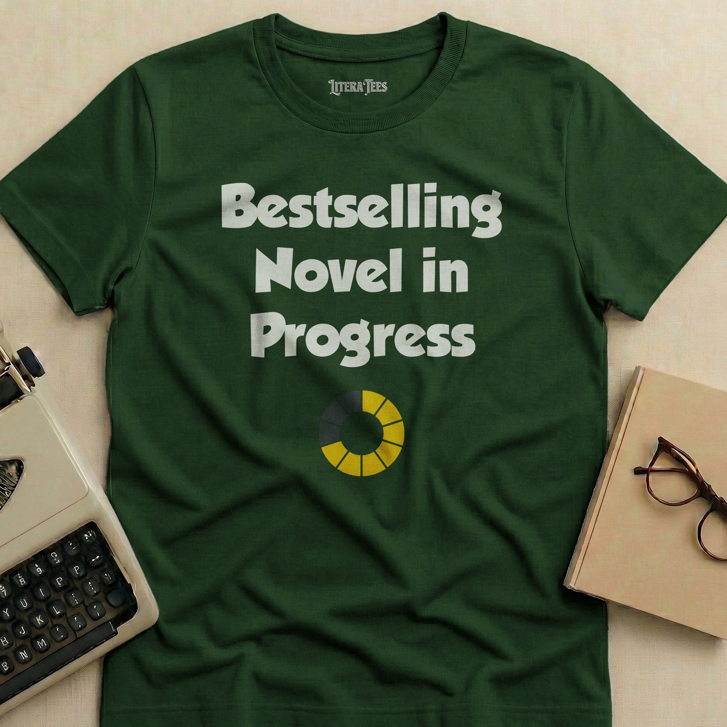 Dark green t-shirt with "Bestselling Novel in Progress" and a loading bar.