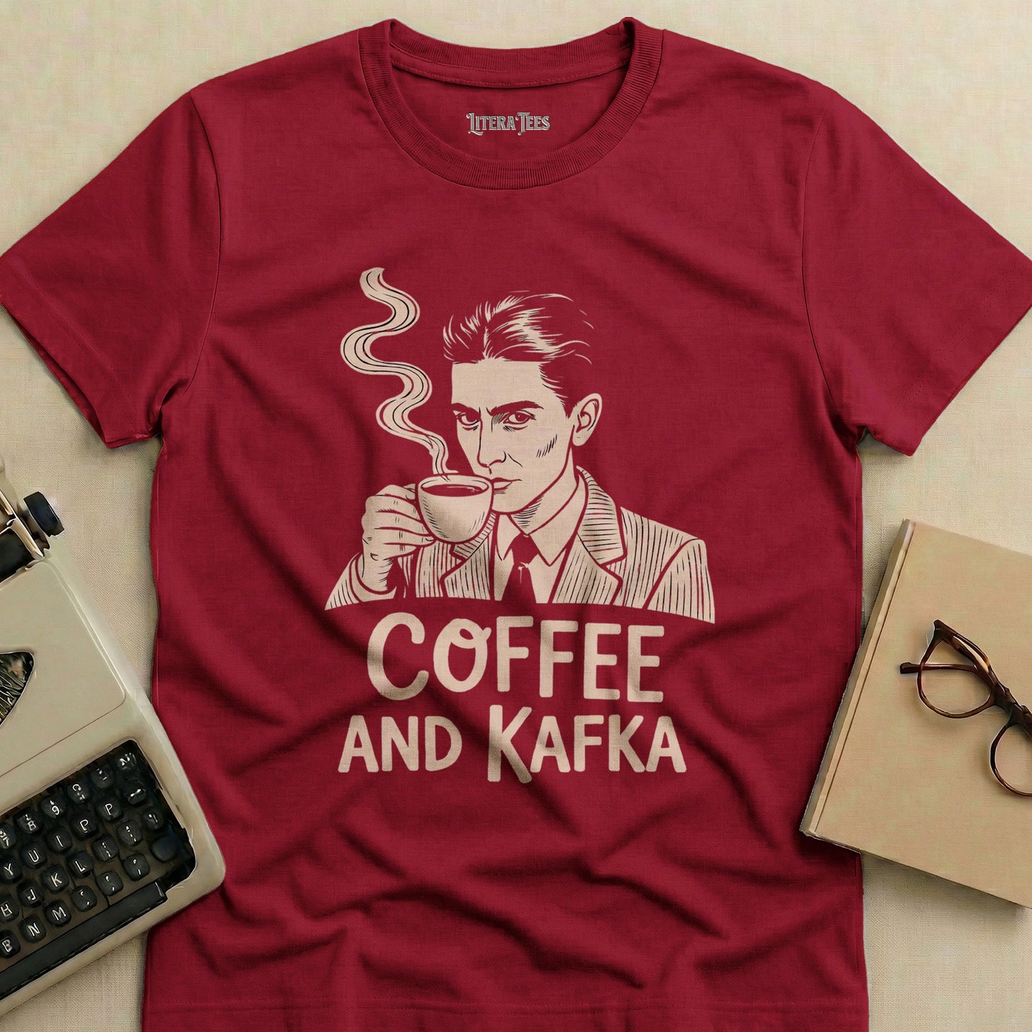 Maroon t-shirt with "Coffee and Kafka" text and a man holding a coffee cup.