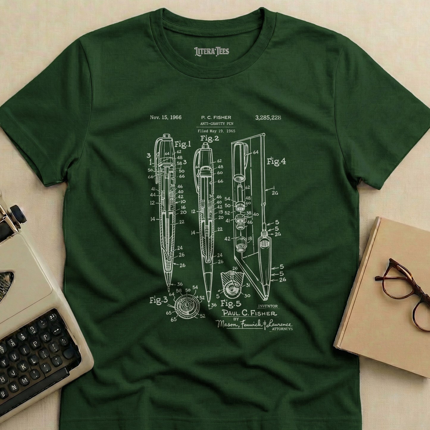 Dark green t-shirt with patent drawing of an anti-gravity pen.
