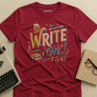 Crimson t-shirt with "WRITE on!" graphic featuring typewriter, pens, and books.