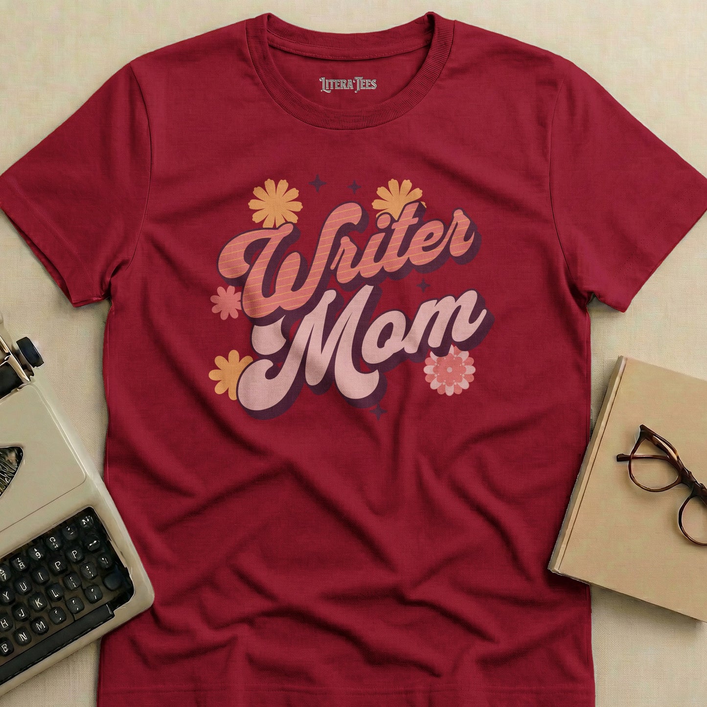 Maroon t-shirt with "Writer Mom" in retro floral lettering.