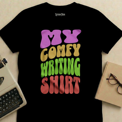 Black t-shirt with "My Comfy Writing Shirt" text in colorful, wavy font.
