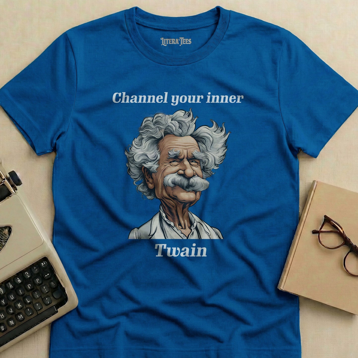 Blue t-shirt with Mark Twain illustration and "Channel your inner Twain" text.