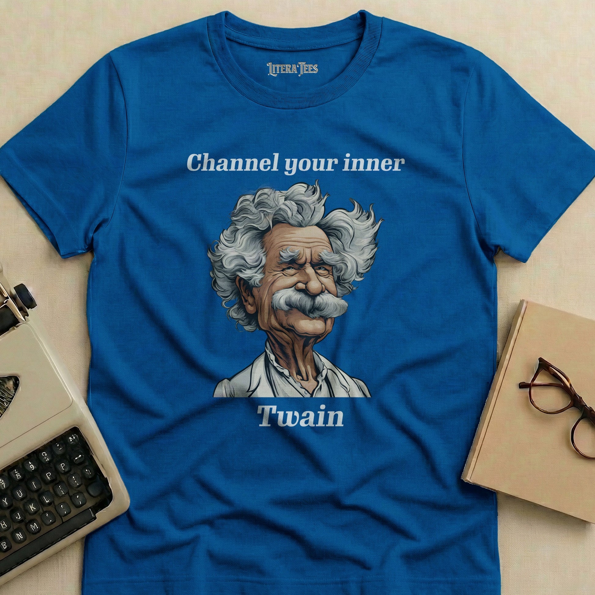 Blue t-shirt with Mark Twain illustration and "Channel your inner Twain" text.