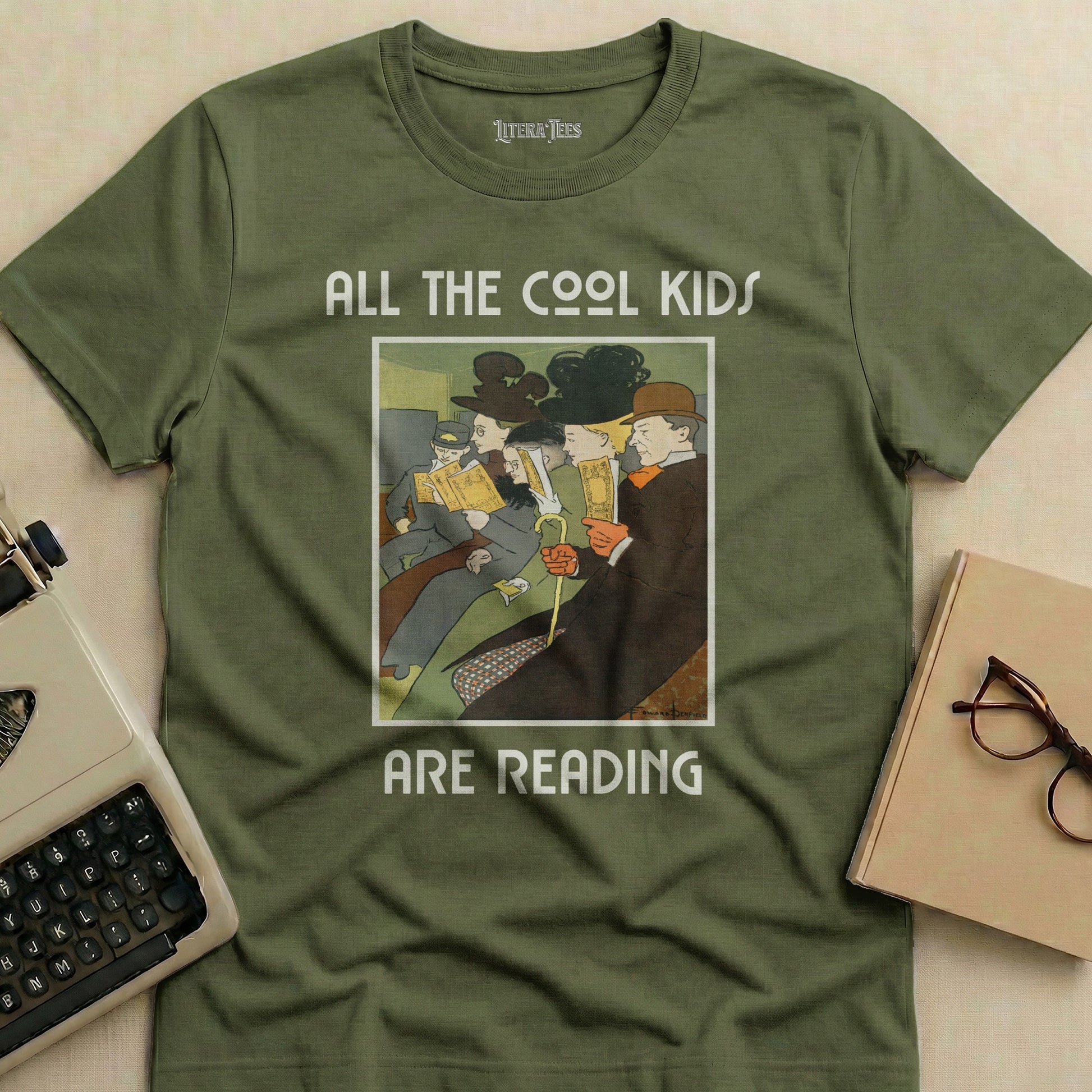 Olive green t-shirt with "ALL THE COOL KIDS ARE READING" and vintage book illustration.