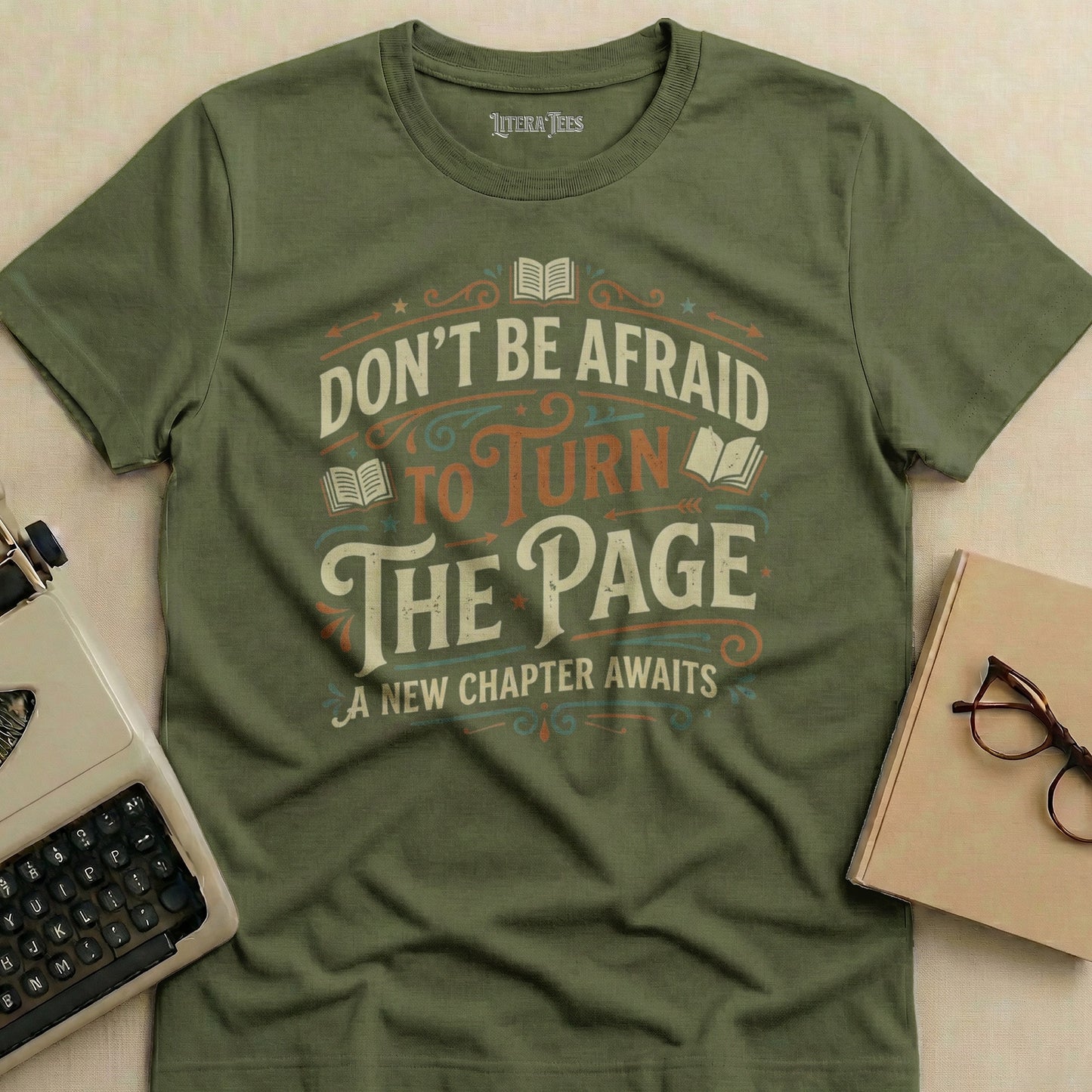 Green t-shirt with "Don't Be Afraid to Turn the Page" text and books.