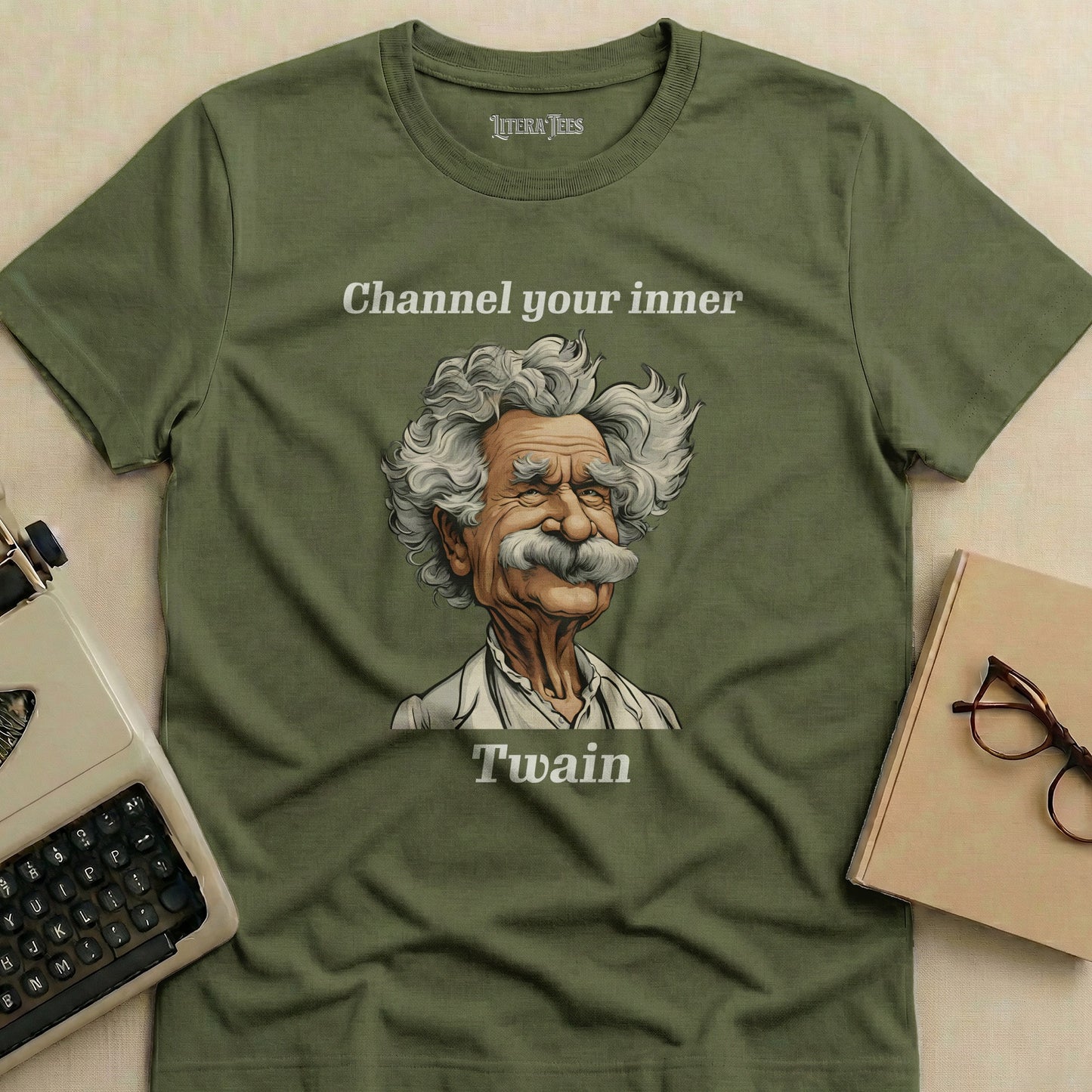 Olive green t-shirt featuring a portrait of Mark Twain and the text "Channel your inner Twain."