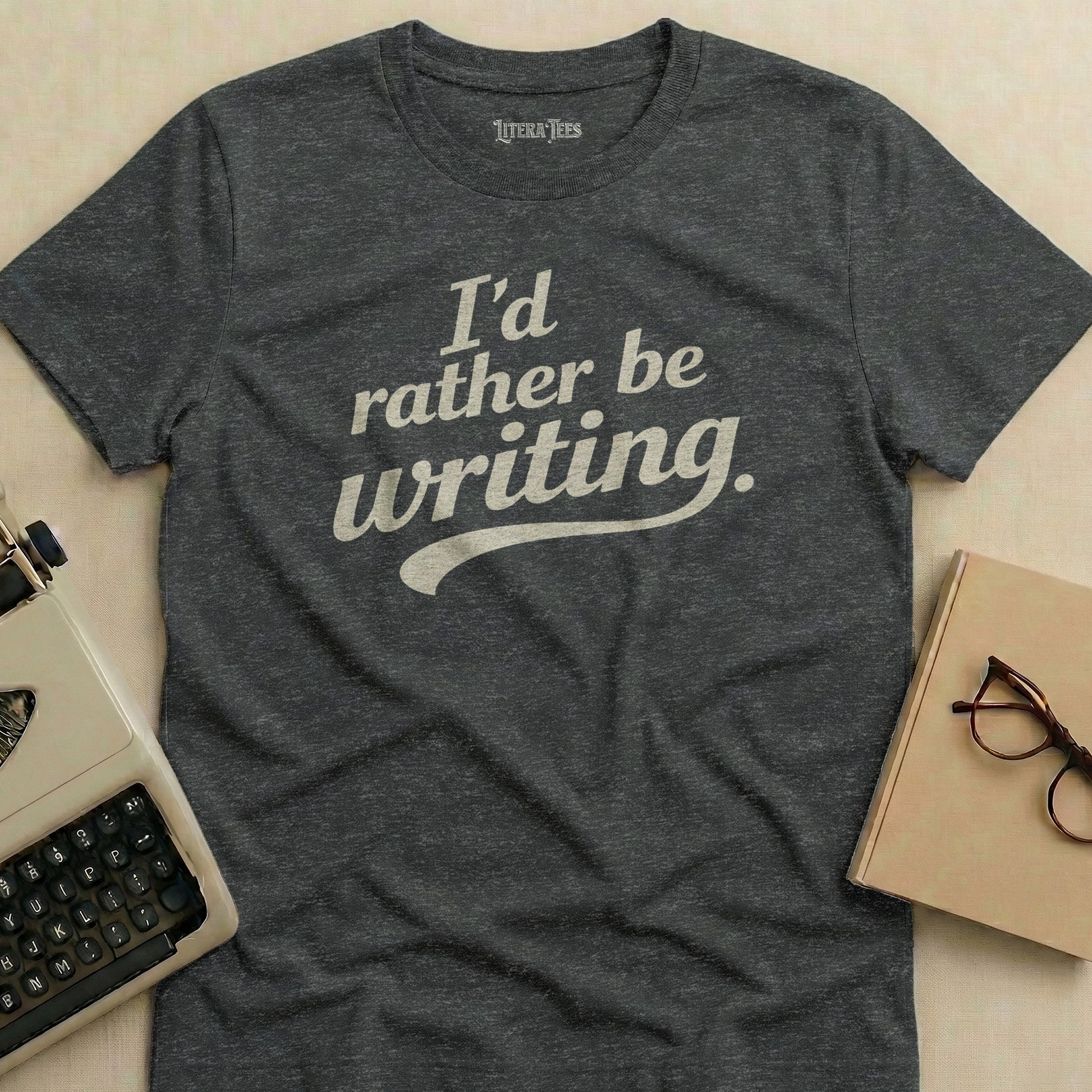 Dark grey t-shirt with "I'd rather be writing." in white text.