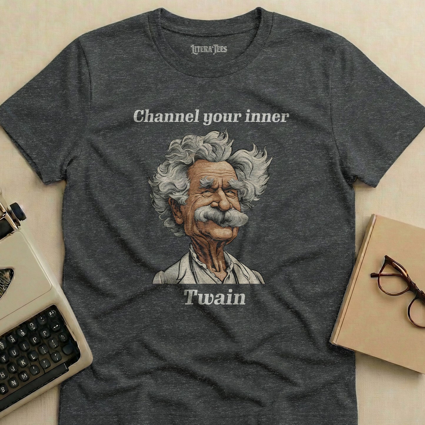 Dark t-shirt with "Channel your inner Twain" and a Mark Twain illustration.
