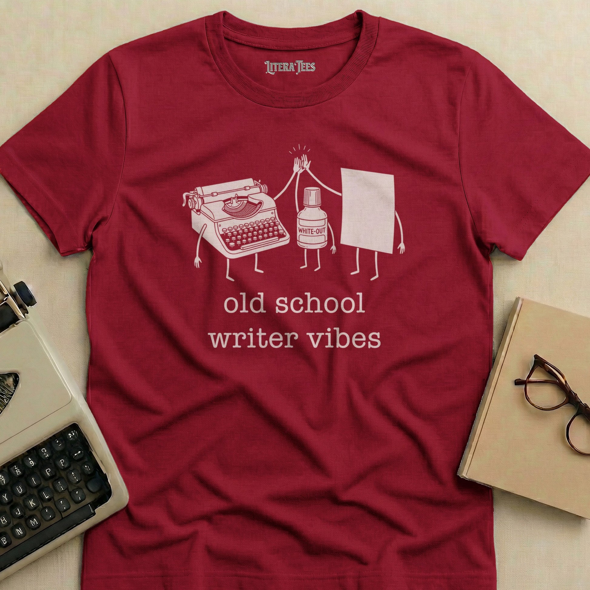 Maroon t-shirt with "old school writer vibes" and illustration.