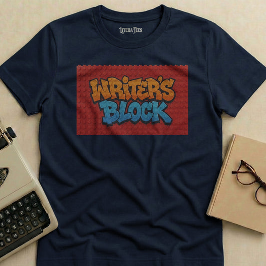 Navy t-shirt with "WRITER'S BLOCK" text on a brick background.