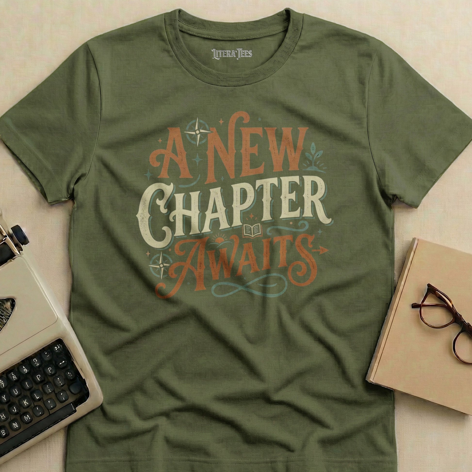 Olive green t-shirt with "A New Chapter Awaits" text design.