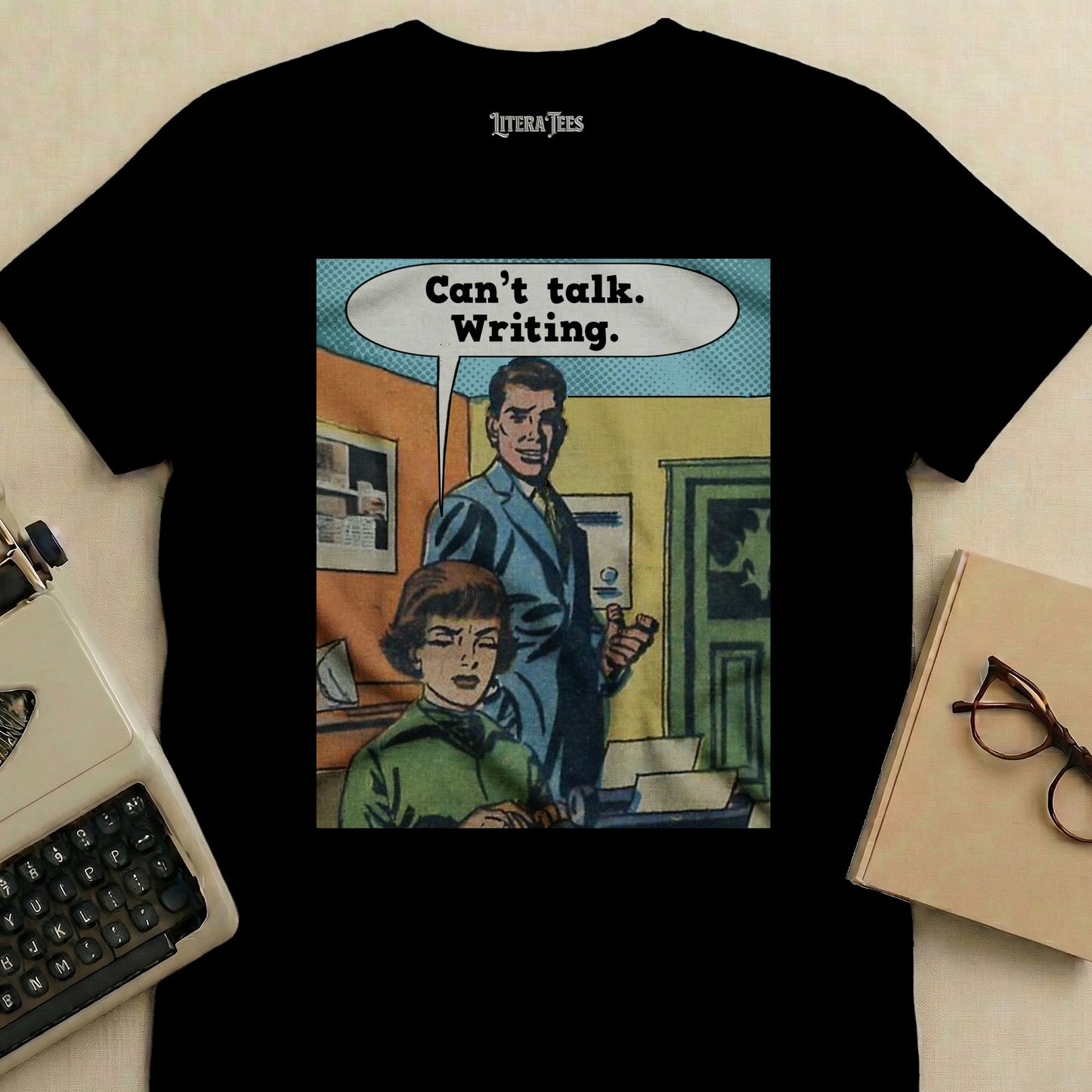 Black t-shirt with "Can't talk. Writing." comic art and Literatees logo.
