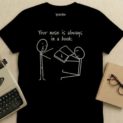 T-shirt with stick figures and text "Your nose is always in a book".