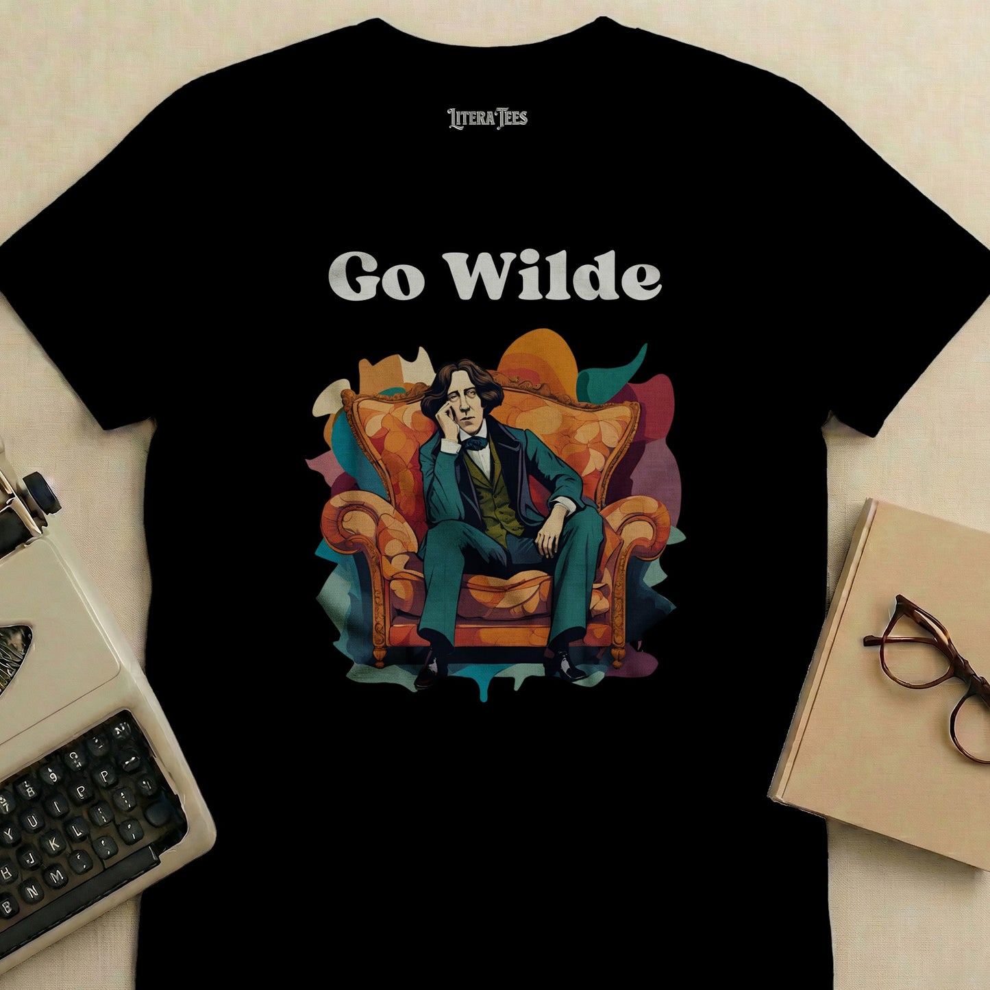 T-shirt with "Go Wilde" and illustration of Oscar Wilde sitting on a chair.