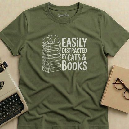 Olive green t-shirt with "Easily Distracted by Cats & Books" text and stacked books.