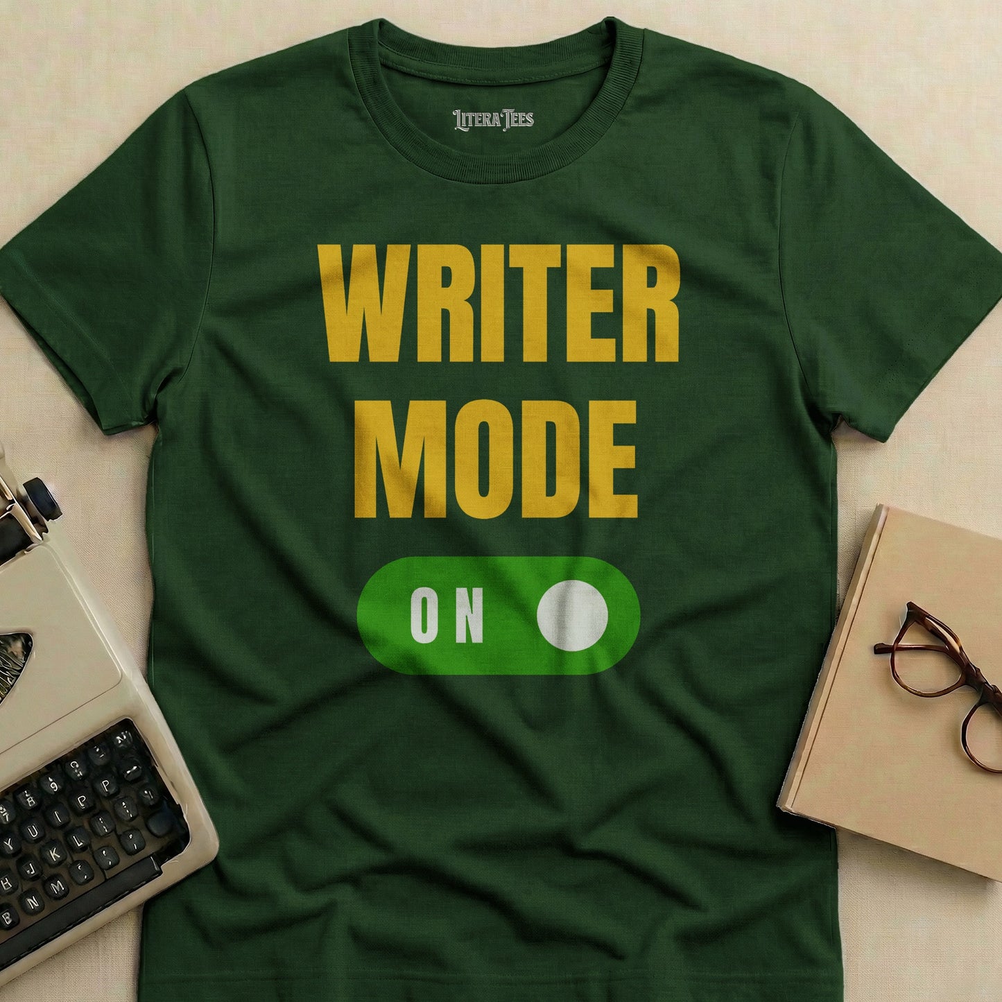 Green t-shirt with "WRITER MODE ON" text and a toggle switch.