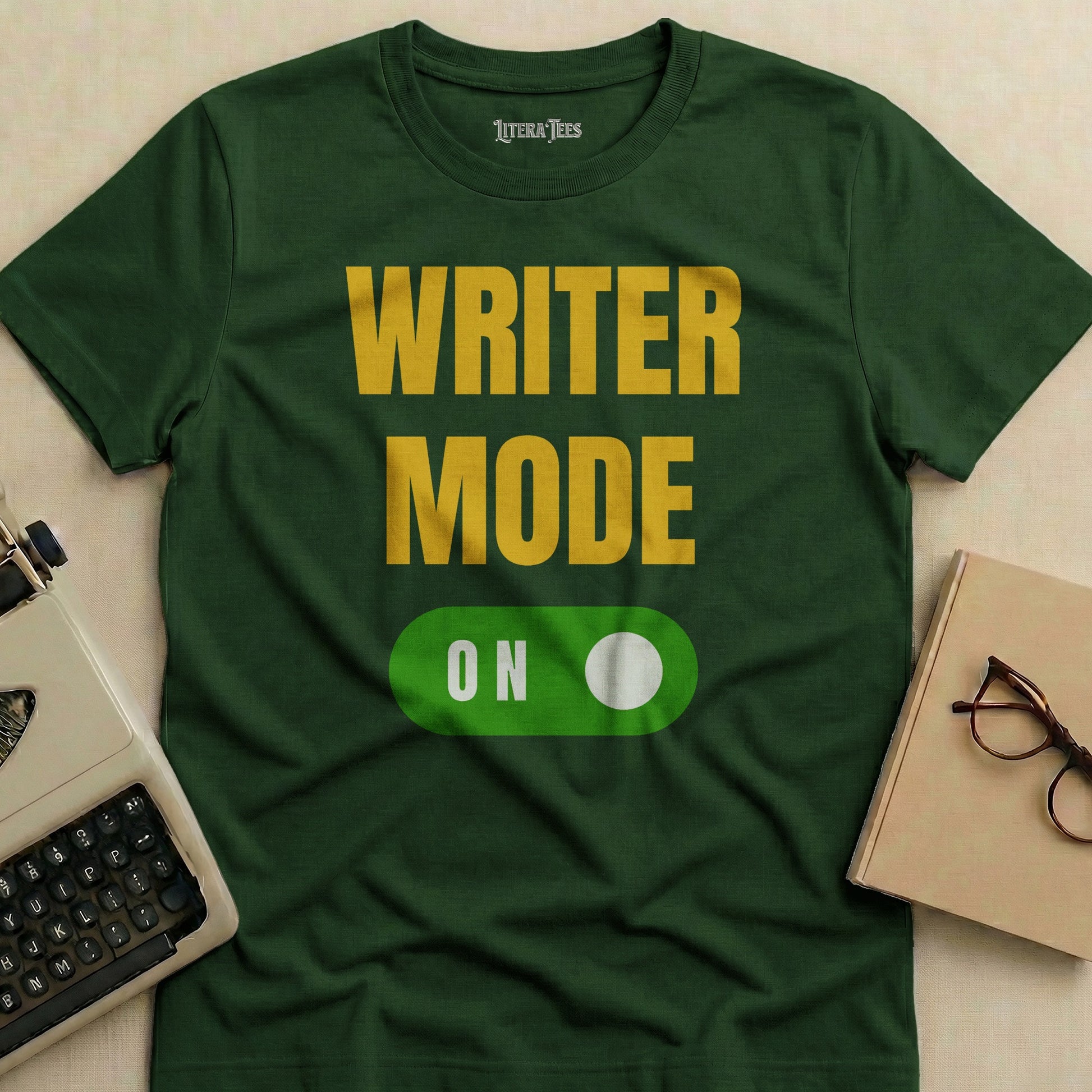 Green t-shirt with "WRITER MODE ON" text and a toggle switch.