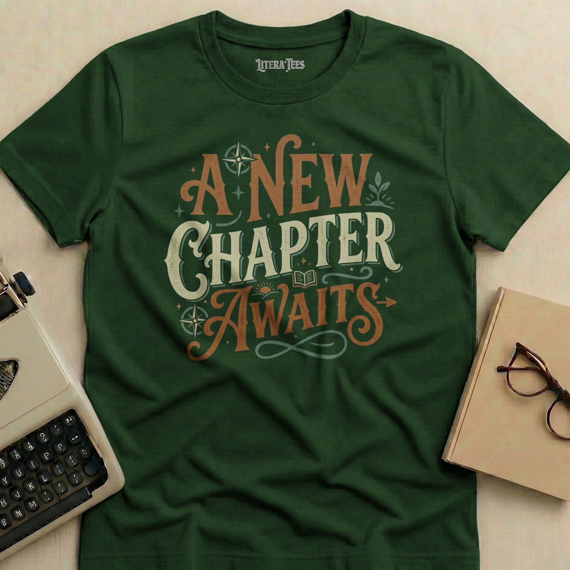 Green t-shirt with "A New Chapter Awaits" text and literary graphic.